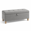 Banc de rangement en tissu gris avec pieds en bois